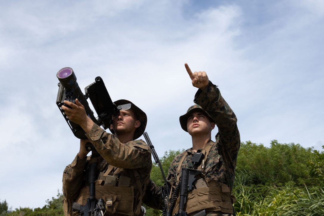 U.S. Marine Corps Pfc. Jessi Fowler, left, and Lance Cpl. Michael Franklin, both low altitude air defense gunners with the 12th Littoral Anti-Air Battalion, 12th Marine Littoral Regiment, 3rd Marine Division, employs the FIM-92 Stinger to provide security for any incoming enemy aircrafts during Resolute Dragon 25 on Kin Blue, Okinawa, Japan, Sept. 21, 2025. Resolute Dragon 25 is an annual bilateral exercise in Japan that strengthens the command, control, and multi-domain maneuver capabilities of U.S. Marines in Ill Marine Expeditionary Force and Japan Self-Defense Force personnel, with a focus on controlling and defending key maritime terrain. Fowler is a native of Tennessee. Franklin is a native of Missouri. (U.S. Marine Corps photo by Lance Cpl. Camila Garibay)