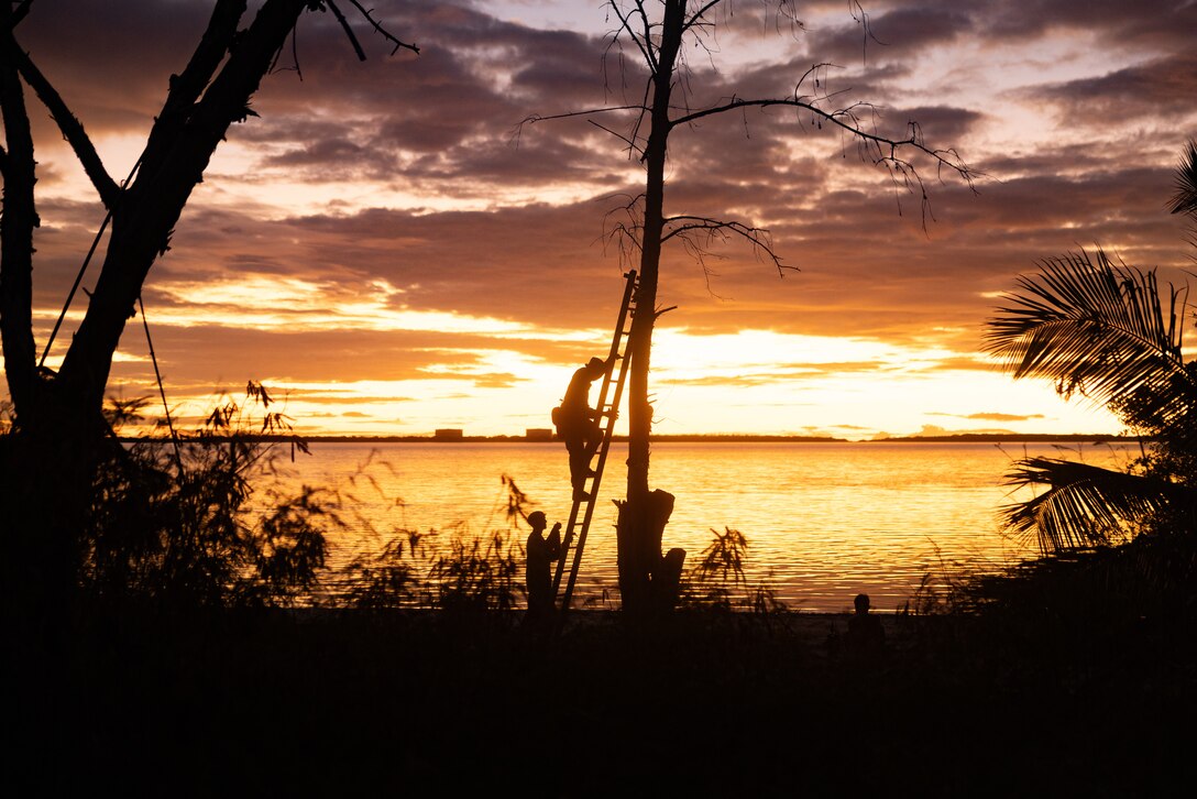 U.S. Marines Corps Sgt. Austin Millette, a transmissions system operator with 12th Littoral Anti-Air Battalion, 12th Marine Littoral Regiment, 3rd Marine Division, establishes communications during a long-range, sensing expeditionary advanced base field training exercise on Wake Island, Dec. 11, 2025. During the exercise, 12th LAAB occupied two EABs, executing simultaneous operations across Wake Island and Camp Hansen. (U.S. Marine Corps photo by Lance Cpl. Robert Blanks)