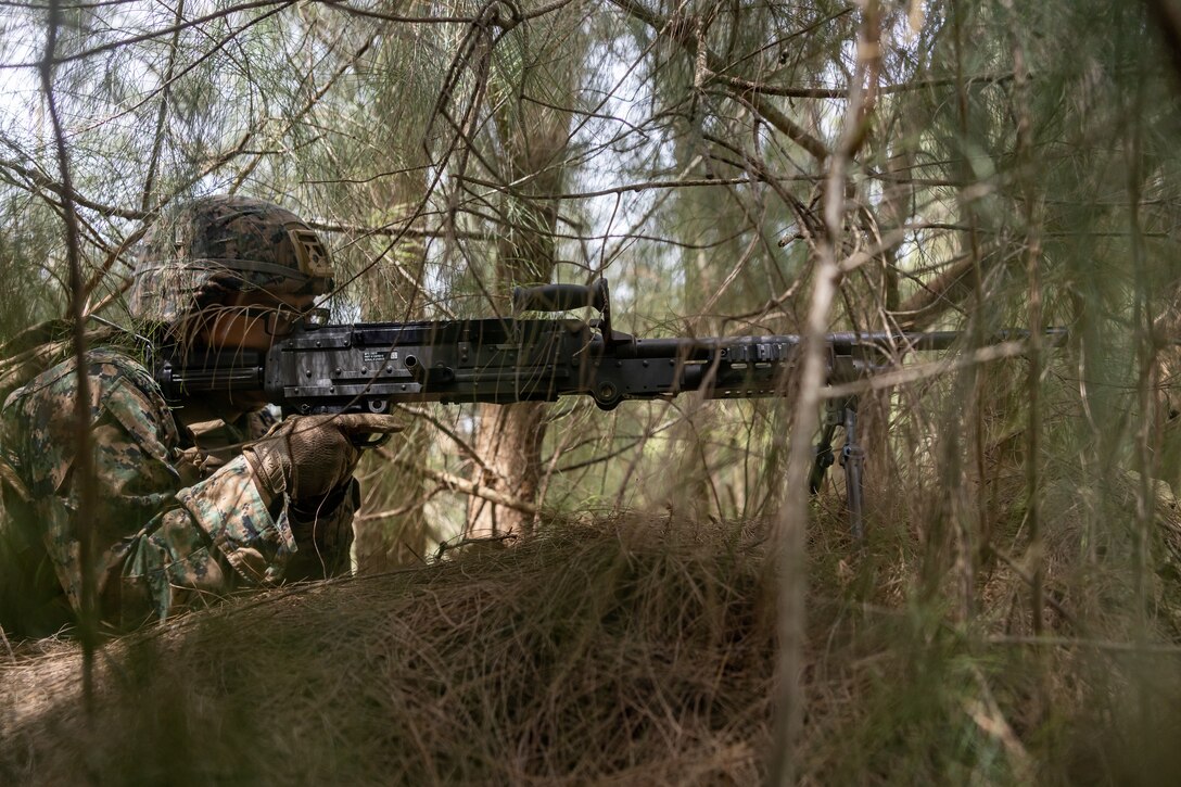 U.S. Marine Lance Cpl. Dario Alvarez, a low altitude air defense gunner with 12th Littoral Anti-Air Battalion, 12th Marine Littoral Regiment, 3rd Marine Division, posts security with an M240B machine gun during Resolute Dragon 25, on Camp Hansen, Okinawa, Japan, Sept. 21, 2025. Resolute Dragon is an annual bilateral exercise in Japan that strengthens the command, control, and multi-domain maneuver capabilities of U.S. Marines in III Marine Expeditionary Force and Japan Self-Defense Force personnel, with a focus on controlling and defending key maritime terrain. Alvarez is a native of Texas. (U.S. Marine Corps photo by Cpl. Lucas Lu)