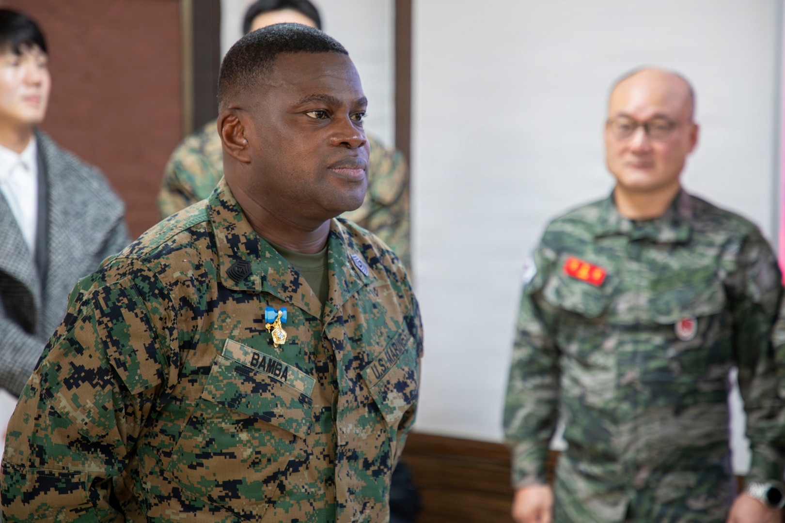 U.S. Marine Corps Sgt. Maj. Ismael G. Bamba, command senior enlisted leader of Marine Forces Korea, stands at attention as his citation is read during his award ceremony at Republic of Korea Marine Corps Headquarters at Camp Baran, South Korea, Feb. 3, 2026. The commendation highlights significant efforts supporting regional stability, alliance readiness and combined operational effectiveness on the Korean Peninsula. (U.S. Marine Corps photo by Gunnery Sgt. Antonio Campbell)