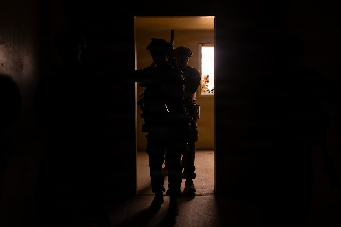 U.S. Marines with 1st Battalion, 25th Marine Regiment enter a room during the Intermediate Location (ILOC) event held at Camp Pendleton, California, Feb. 10, 2026. ILOC is a pre-deployment event to ensure combat readiness, emphasizing small-unit leadership roles and responsibilities. (U.S. Marine Corps photo by Lance Cpl. Claire Cheney)