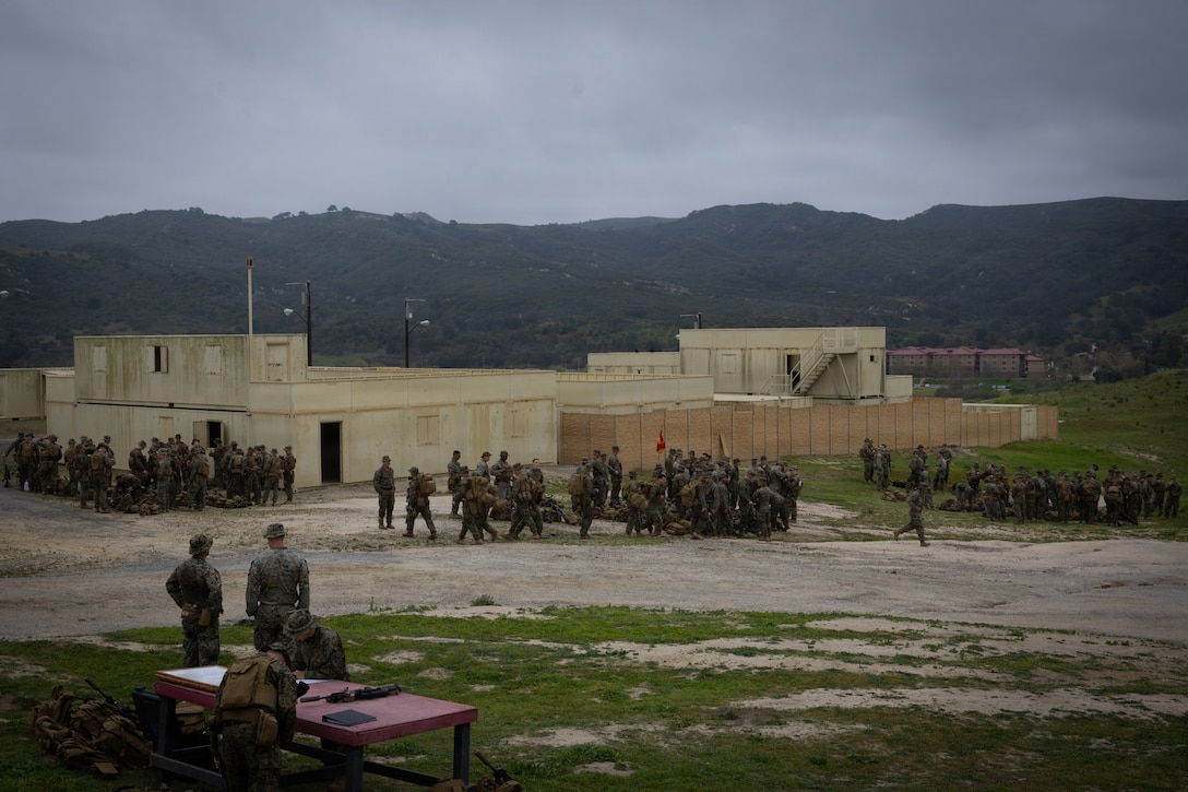 U.S. Marines with 1st Battalion, 25th Marine Regiment prepare for the Military Operations on Urbanized Terrain (MOUT) training segment of the Intermediate Location (ILOC) event held at Camp Pendleton, California, Feb. 10, 2026. ILOC is a pre-deployment event to ensure combat readiness, emphasizing small-unit leadership roles and responsibilities. (U.S. Marine Corps photo by Lance Cpl. Claire Cheney)