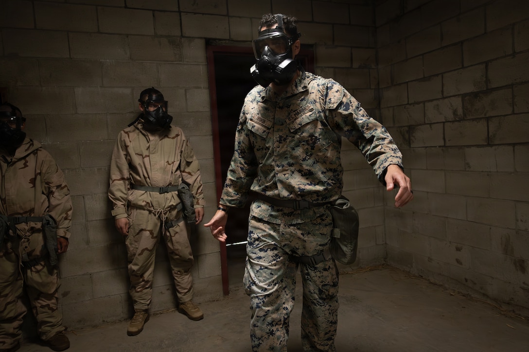 U.S. Marine Corps Sgt. Anthony Yordi, a chemical, biological, radiological and nuclear defense specialist, with 2nd Battalion, 1st Marine Regiment enters a gas chamber during an Intermediate Location (ILOC) event held at Camp Pendleton, California, Feb. 9, 2026. ILOC is a pre-deployment event to ensure readiness, emphasizing small-unit leadership roles and responsibilities. (U.S. Marine Corps photo by Lance Cpl. Claire Cheney)