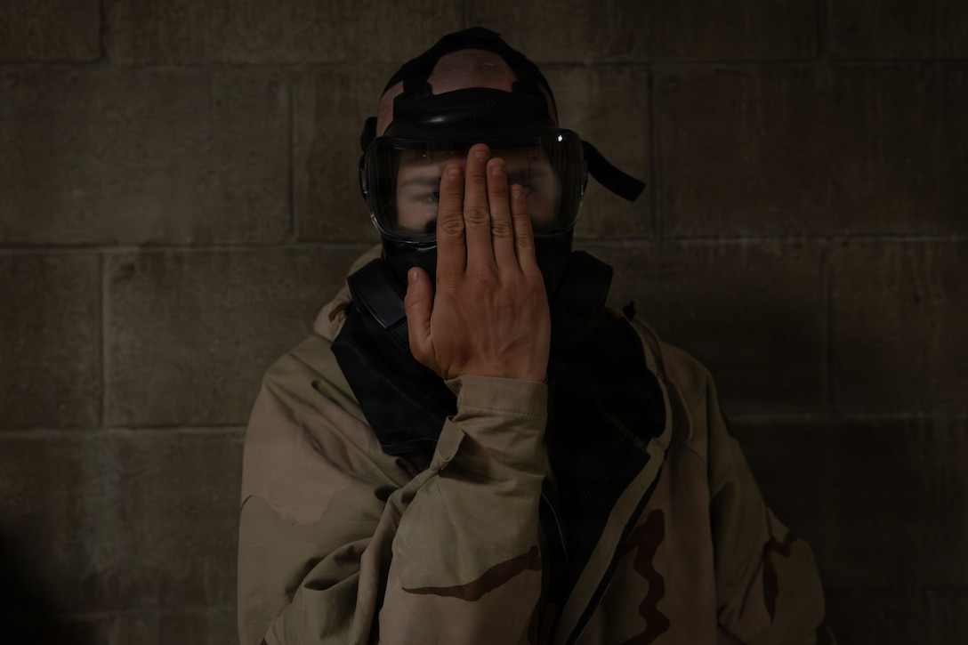 A U.S. Marine with 1st Battalion, 25th Marine Regiment, clears a gas mask during an Intermediate Location (ILOC) event held at Camp Pendleton, California, Feb. 9, 2026. ILOC is a pre-deployment event to ensure readiness, emphasizing small-unit leadership roles and responsibilities. (U.S. Marine Corps photo by Lance Cpl. Claire Cheney)