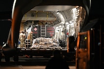 Joint Base Charleston personnel prepare to offload a pallet from a C-17 Globemaster III aircraft upon returning from Operation Palmetto Reach, a part of Combat Readiness Exercise 2026, at Joint Base Charleston.