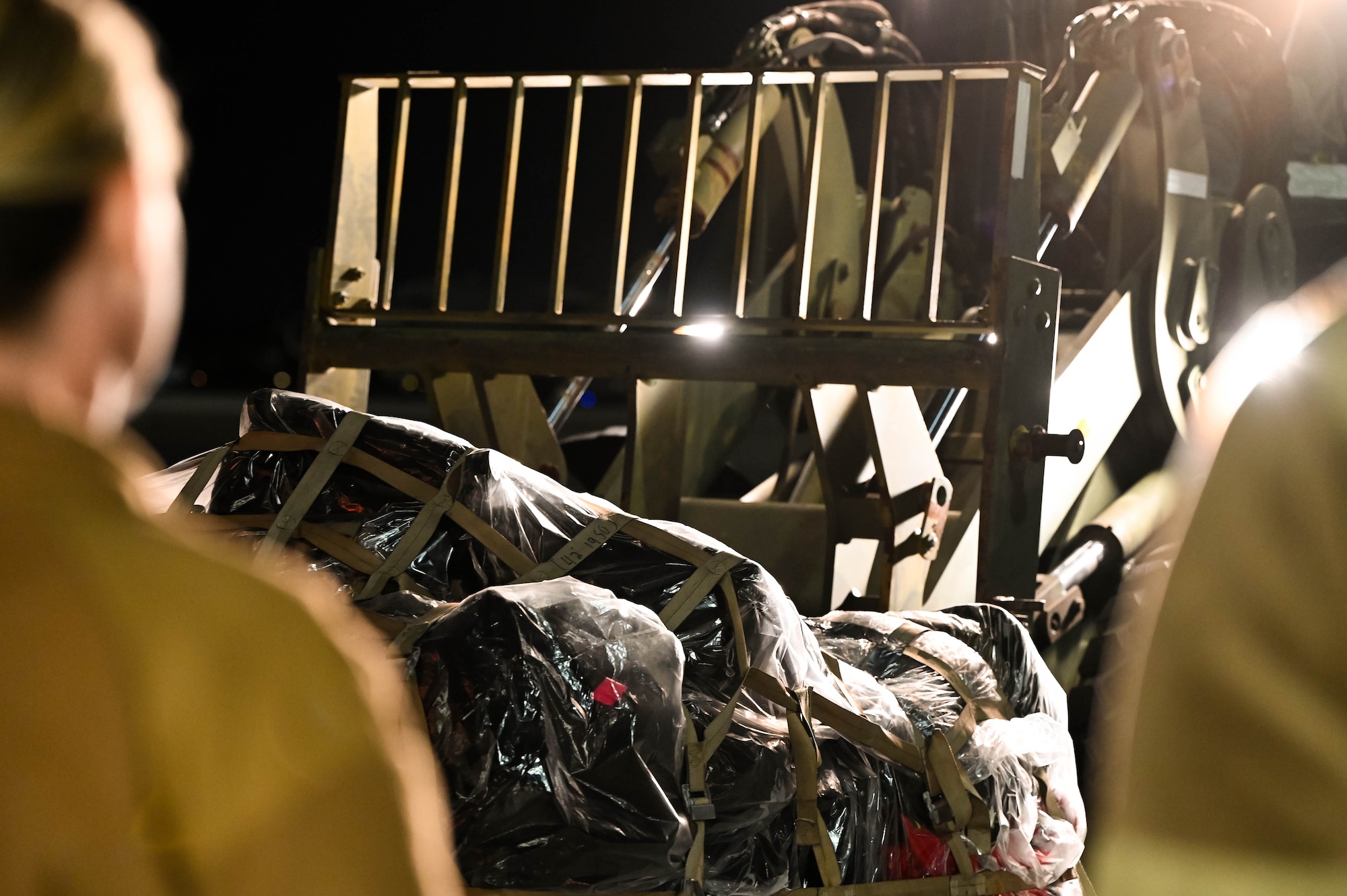 U.S. Air Force Airman 1st Class Matthew Delaney, 437th Airlift Wing air transportation specialist, operates a forklift carrying a pallet of luggage returning from Operation Palmetto Reach, a part of Combat Readiness Exercise 2026, at Joint Base Charleston.