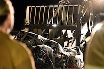 U.S. Air Force Airman 1st Class Matthew Delaney, 437th Airlift Wing air transportation specialist, operates a forklift carrying a pallet of luggage returning from Operation Palmetto Reach, a part of Combat Readiness Exercise 2026, at Joint Base Charleston.