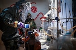 Soldiers of the Guam and New Mexico National Guards, together with Airmen from the Andersen Air Force Base Chemical, Biological, Radiological and Explosives Response Team, survey a clandestine drug laboratory during a multiagency exercise hosted by the Guam Guard, Barrigada, Feb. 18, 2026. The exercise, which included first responders and law enforcement from the government of Guam, aims to sharpen the individual skills of responders while improving interoperability between partners. Photo by Mark Scott.