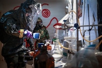Soldiers of the Guam and New Mexico National Guards, together with Airmen from the Andersen Air Force Base Chemical, Biological, Radiological and Explosives Response Team, survey a clandestine drug laboratory during a multiagency exercise hosted by the Guam Guard, Barrigada, Feb. 18, 2026.