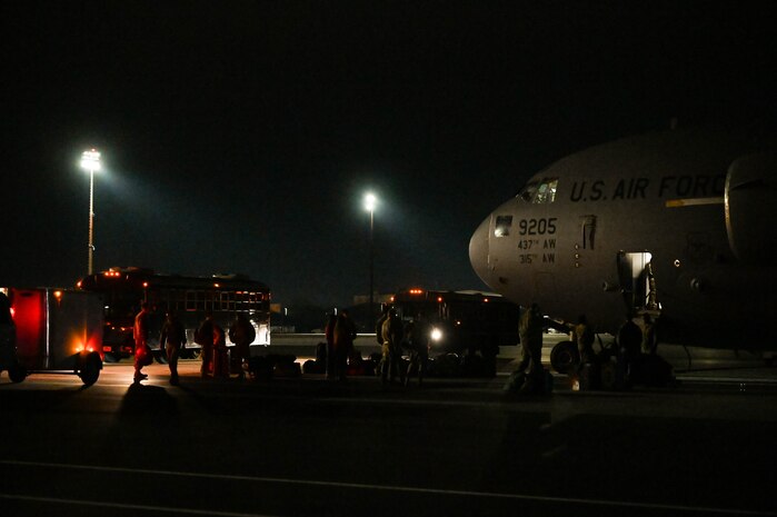 Joint Base Charleston Airmen deplane from a C-17 Globemaster III aircraft upon returning from Operation Palmetto Reach, a part of Combat Readiness Exercise 2026, at Joint Base Charleston.