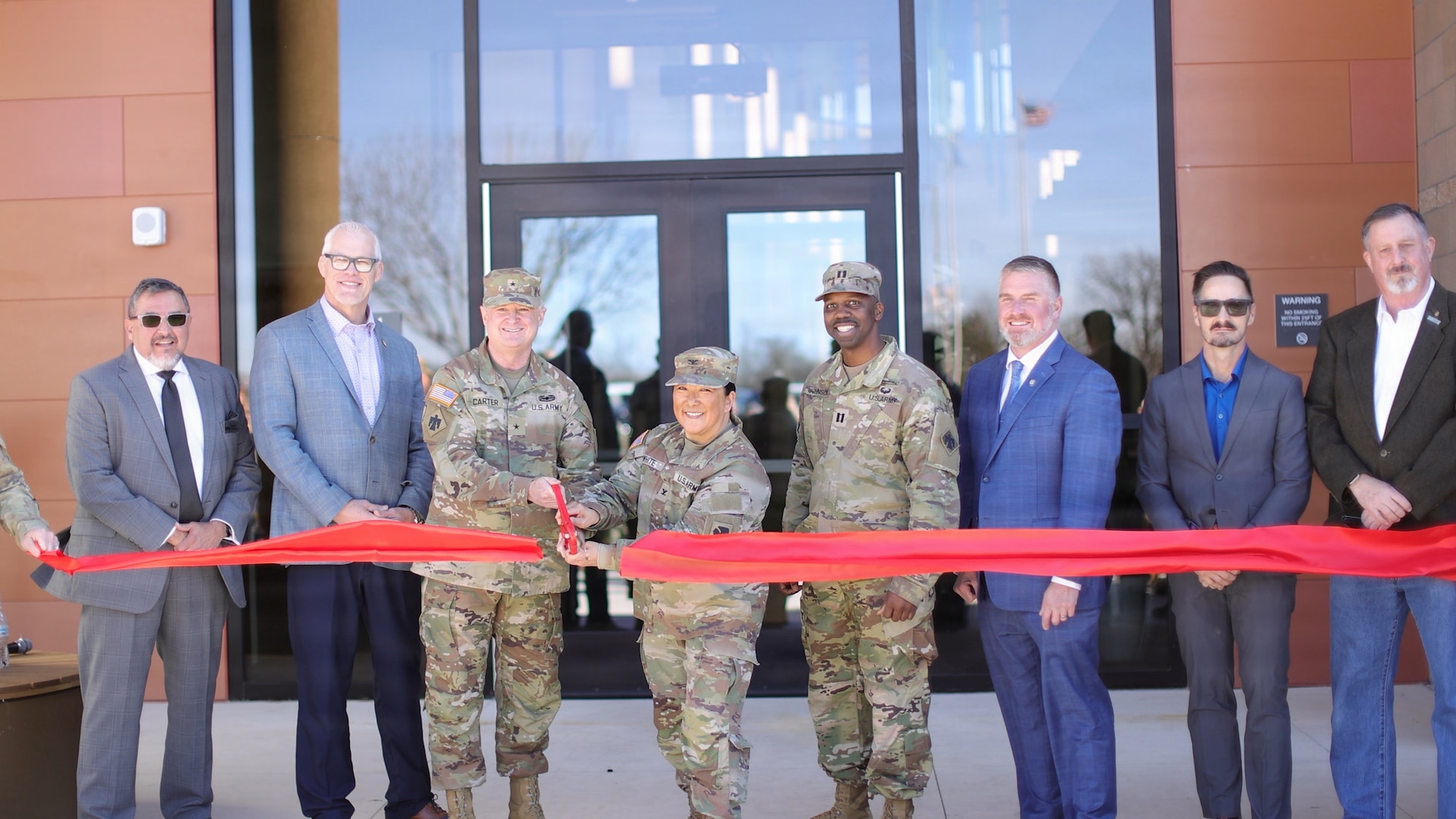 Brig. Gen. Brad Carter, Col. Lindy White and Capt. E.J. Johnson, Oklahoma Army National Guard, are joined by Oklahoma Rep. Chris Kannady, as well as representatives from Flintco Construction, Larson Design Group and Oklahoma Army National Guard Construction and Facilities Maintenance Office, during the ribbon cutting ceremony for the Oklahoma National Guard Wellness Center in Oklahoma City, Feb. 19, 2026.