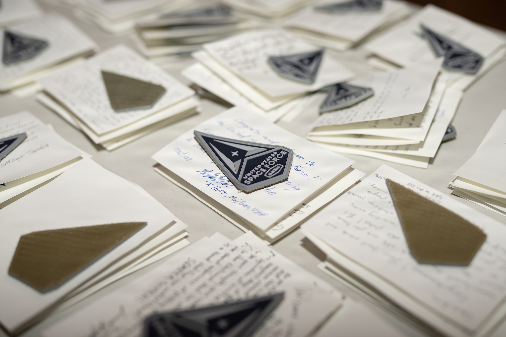 New U.S. Space Force patches sit atop notes from Guardians from around the Space Force.