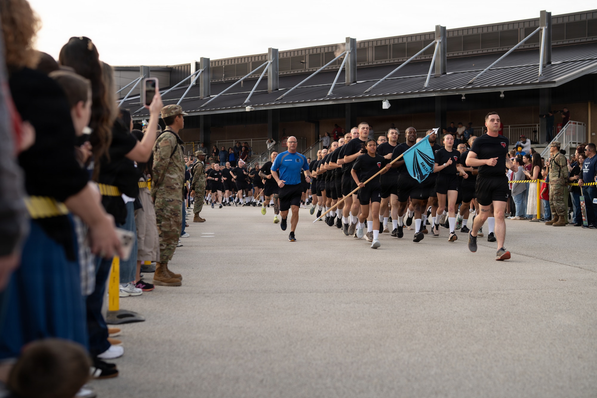 Chief Master Sgt. of the Space Force John Bentivegna leads a formation of U.S. Space Force Basic Military Training graduates during the ceremonial “Airman and Guardian’s Run” at BMT’s Pfingston Reception Center, Joint Base San Antonio-Lackland, Texas, Feb. 18, 2026. The “Airman and Guardian's Run” is a one-and-a-half-mile run that celebrates the culmination of U.S. Air Force and U.S. Space Force Basic Military Training, giving guests the opportunity to get a glimpse of their trainee-turned-graduate for the first time in 7.5 weeks. (U.S. Air Force photo by Jonathan R. Mallard)