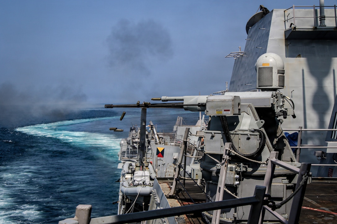 A Mark 38 25mm machine gun fires during a live-fire exercise aboard Arleigh Burke-class guided-missile destroyer USS Frank E. Petersen Jr. (DDG 121), Feb. 10, 2026. Frank E. Peterson Jr. is deployed to the U.S. 5th Fleet area of operations to support maritime security and stability throughout the Middle East. (U.S. Navy photo by Mass Communication Specialist 2nd Class Christian Kibler)