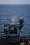 A Mark 38 25mm machine gun fires at a training target during a live-fire exercise aboard Arleigh Burke-class guided-missile destroyer USS Frank E. Petersen Jr. (DDG 121), Feb. 10, 2026. Frank E. Peterson Jr. is deployed to the U.S. 5th Fleet area of operations to support maritime security and stability throughout the Middle East. (U.S. Navy photo by Mass Communication Specialist 2nd Class Christian Kibler)