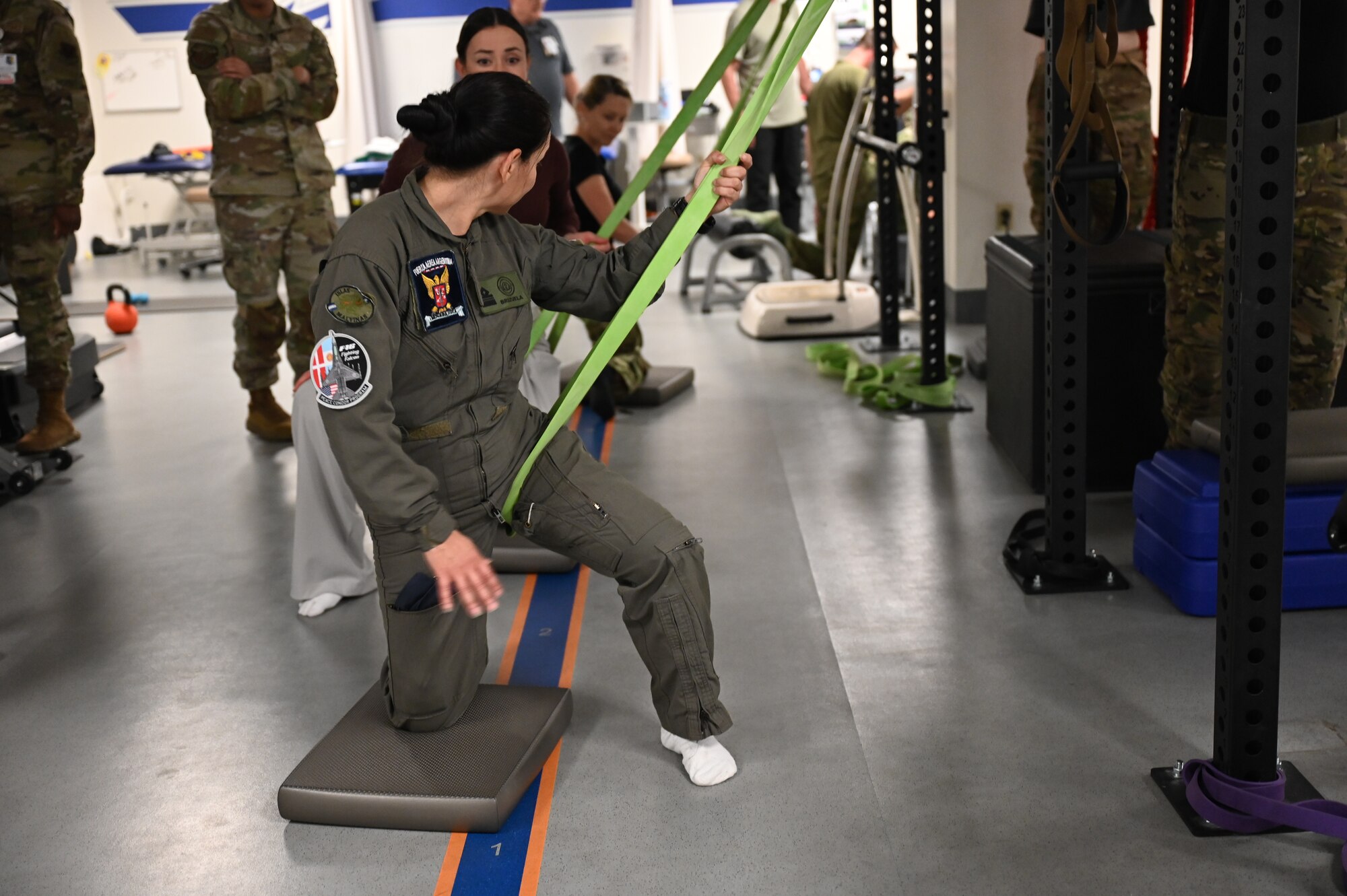 A Fuerza Aérea Argentina (FAA) member practices a physical therapy stretching technique at Davis-Monthan Air Force Base, Arizona, Jan. 6, 2026. The Argentine air force learned whole body health practices designed to support the unique physical demands on F-16 fighter pilots, requiring specialized flight medicine, physical therapy and conditioning. (U.S. Air Force photo by Staff Sgt. Abbey Rieves)