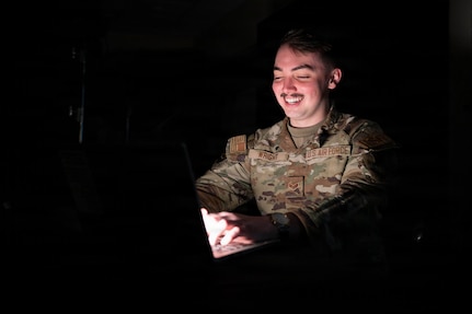 Airman types on a computer.