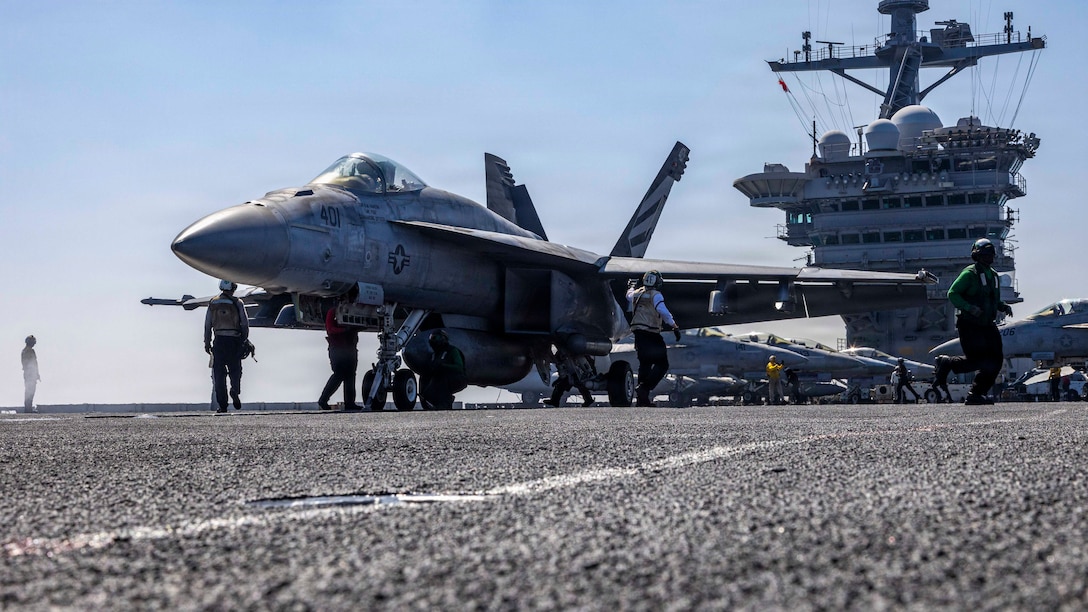 An F/A-18E Super Hornet, attached to Strike Fighter Squadron (VFA) 151, prepares to launch from the flight deck of Nimitz-class aircraft carrier USS Abraham Lincoln (CVN 72) in the Arabian Sea, Feb. 15, 2026. Abraham Lincoln is deployed to the U.S. 5th Fleet area of operations to support maritime security and stability in the Middle East. (U.S. Navy photo by Mass Communication Specialist Seaman Daniel Kimmelman)