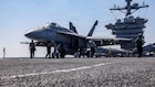 An F/A-18E Super Hornet, attached to Strike Fighter Squadron (VFA) 151, prepares to launch from the flight deck of Nimitz-class aircraft carrier USS Abraham Lincoln (CVN 72) in the Arabian Sea, Feb. 15, 2026. Abraham Lincoln is deployed to the U.S. 5th Fleet area of operations to support maritime security and stability in the Middle East. (U.S. Navy photo by Mass Communication Specialist Seaman Daniel Kimmelman)