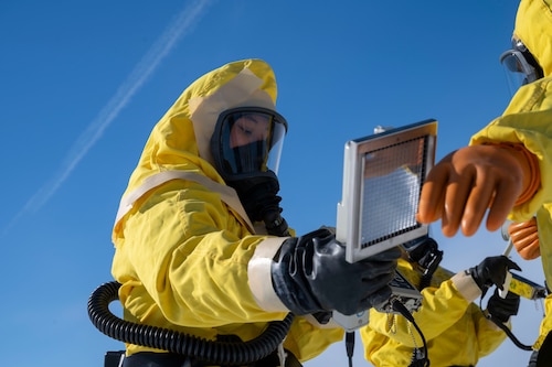 U.S. Air Force Senior Airman Jasia Waddell, 87th Civil Engineer Squadron’s Installation Office of Emergency Management training section lead, simulates decontamination procedures on her teammates during a training exercise at Joint Base McGuire-Dix-Lakehurst, N.J., Jan. 28, 2026. The IOEM and the 87th CES Explosive Ordnance Disposal units train together to practice proper communication and evaluate response time between agencies through careful coordination across multiple sections. (U.S. Air Force photo by Airman 1st Class Luisa E. Dugan)