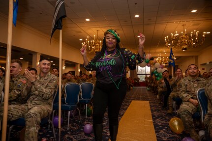 A woman dances down the venue aisle.