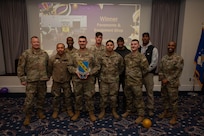 Airmen award winners pose with wing leadership.
