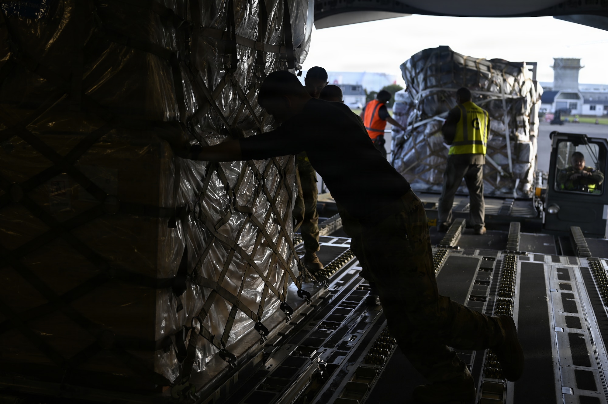 U.S. Airmen and Christchurch Airport personnel load supplies to bring to McMurdo Station in support of Operation Deep Freeze at Christchurch, New Zealand, Feb. 8, 2026. Christchurch has served as the primary logistics staging point for the United States Antarctic Program since 1955. (U.S. Air Force photo by Staff Sgt. Ethan Sherwood)