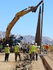 Leaders and staff from the U.S. Army Corps of Engineers oversee BMGR-1 project construction and bollard installation Feb. 9 near Yuma, Arizona. The BMGR-1 border barrier project spans approximately 15 miles, replacing older fencing with steel bollard barriers. USACE is replacing permanent border barriers along the southern border of the U.S. at the direction of the U.S. Army by the Secretary of War, in response to the presidential national emergency declaration dated Jan. 20, 2025, authorizing the use of Section 2803 of Title 10, U.S. Code. (Photo by Robert DeDeaux USACE PAO)