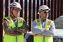 U.S. Army Corps of Engineers’ Mark Wetsel, Deputy Commander, and Brad Carter, Deputy Chief of Program Management, assigned to the South Pacific Border Task Force, attend a safety brief before reviewing barrier installation at the BMGR-1 project site near Feb. 9 near Yuma, Arizona. USACE is replacing permanent border barriers along the southern border of the U.S. at the direction of the U.S. Army by the Secretary of War, in response to the presidential national emergency declaration dated Jan. 20, 2025, authorizing the use of Section 2803 of Title 10, U.S. Code. (Photo by Robert DeDeaux USACE PAO)
