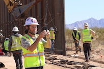 U.S. Army Corps of Engineers’ Arthur Eyrich, a contract specialist assigned to the South Pacific Border Task Force, collects images of construction progress at the BMGR-1 project site near Feb. 9 near Yuma, Arizona. USACE is replacing permanent border barriers along the southern border of the U.S. at the direction of the U.S. Army by the Secretary of War, in response to the presidential national emergency declaration dated Jan. 20, 2025, authorizing the use of Section 2803 of Title 10, U.S. Code. (Photo by Robert DeDeaux USACE PAO)