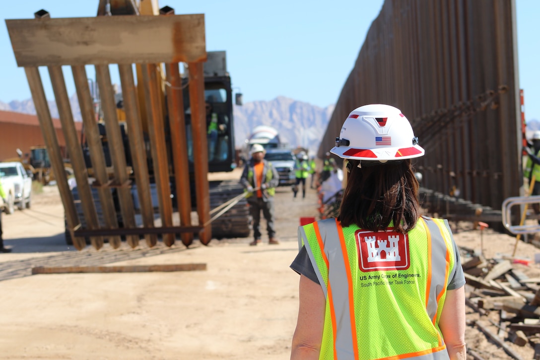 Leaders and staff from the U.S. Army Corps of Engineers oversee BMGR-1 project construction and bollard installation Feb. 9 near Yuma, Arizona. The BMGR-1 border barrier project spans approximately 15 miles, replacing older fencing with steel bollard barriers. USACE is replacing permanent border barriers along the southern border of the U.S. at the direction of the U.S. Army by the Secretary of War, in response to the presidential national emergency declaration dated Jan. 20, 2025, authorizing the use of Section 2803 of Title 10, U.S. Code. (Photo by Robert DeDeaux USACE PAO)