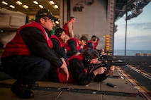 Sailors fire M4 rifles during a live fire evolution aboard America-class amphibious assault ship USS Tripoli (LHA 7) Feb. 15, 2026.