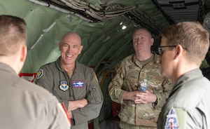 U.S. Air Force Lt. Gen. Clark Quinn, commander of Air Education and Training Command (AETC), left, and Chief Master Sgt. Chad Bickley, command chief of AETC, right, speaks to KC-135 Stratotanker crew members at Altus Air Force Base, Oklahoma, Feb. 18, 2026. The immersion demonstrated AETC leadership’s dedication to fully connecting to the wing's mission of developing the decisive mobility force of the future. (U.S. Air Force photo by Airman 1st Class Emma Wright)