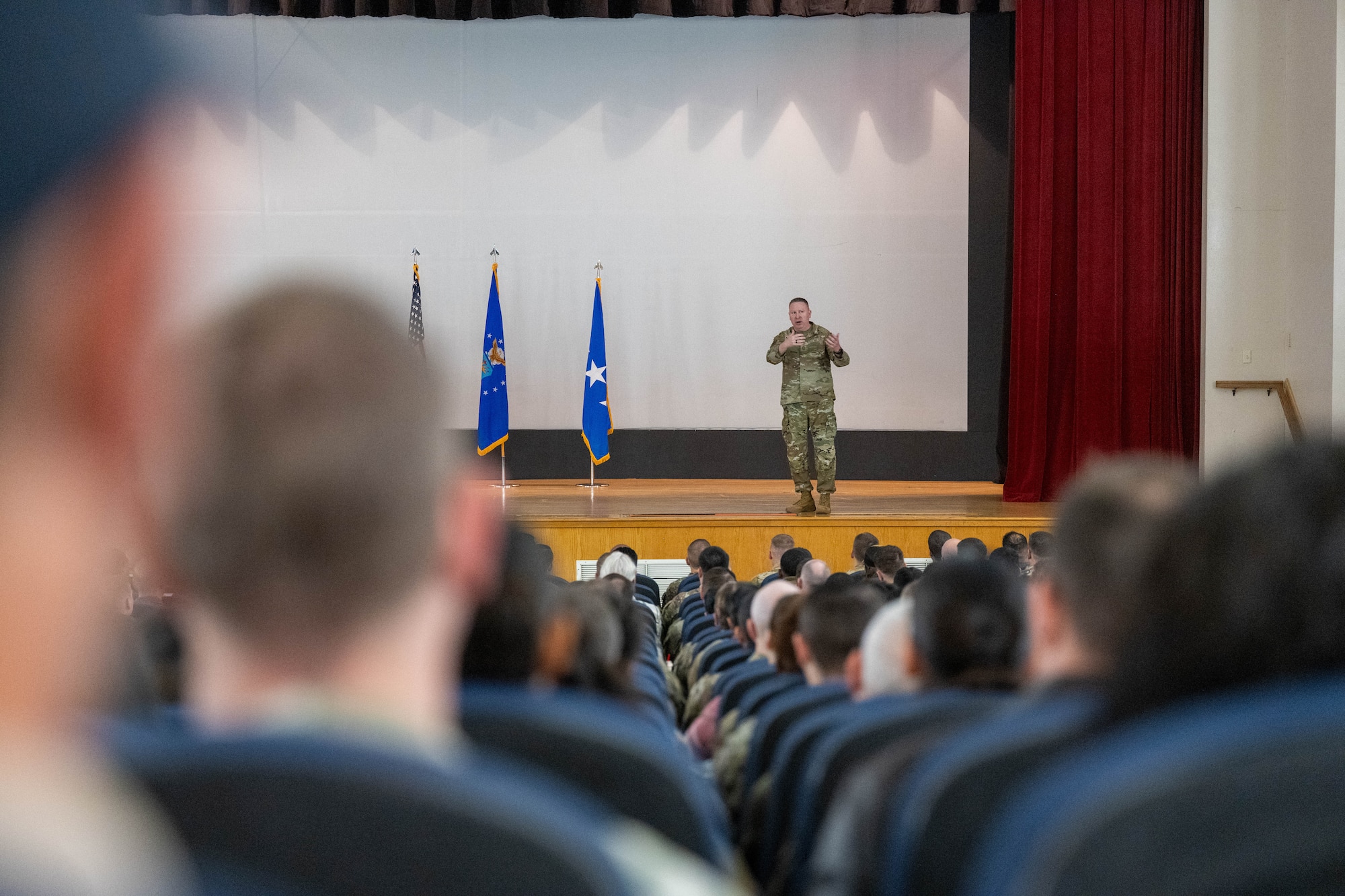 U.S. Air Force Chief Master Sgt. Chad Bickley, command chief of Air Education and Training Command (AETC), speaks to Airmen of the 97th Air Mobility Wing during an all-call at Altus Air Force Base, Oklahoma, Feb. 19, 2026. The all-call helped Airmen of the 97th Air Mobility Wing understand AETC’s priorities and how they fit into the strategic mission of the command. (U.S. Air Force photo by Airman 1st Class Emma Wright)