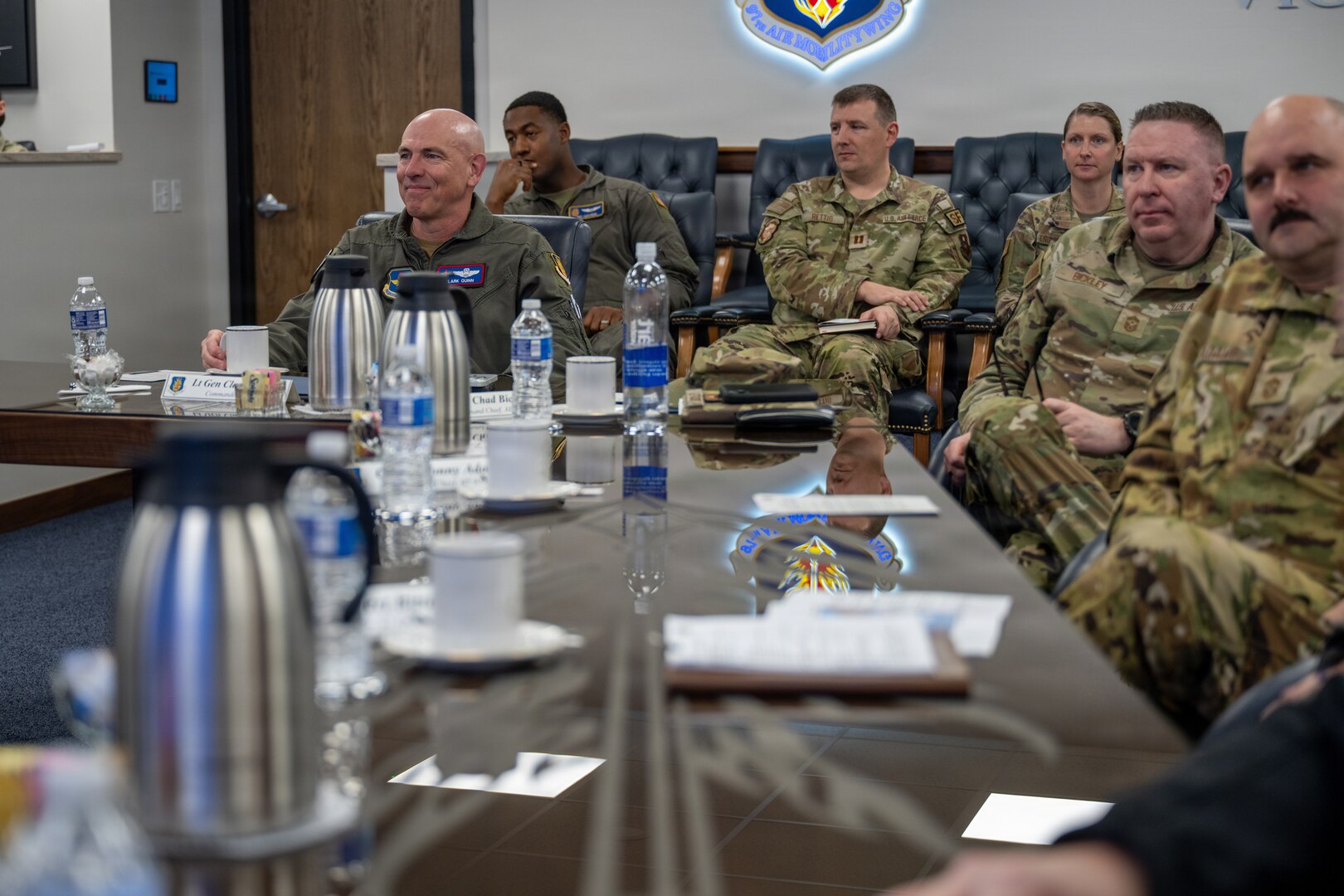 U.S. Air Force Lt. Gen. Clark Quinn, commander of Air Education and Training Command (AETC), and Chief Master Sgt. Chad Bickley, command chief of AETC, receive a mission brief from 97th Air Mobility Wing leadership at Altus Air Force Base, Oklahoma, Feb. 18, 2026. The briefing displayed Quinn's dedication to fully connecting with Altus’ mission and provided an opportunity to highlight the 97th Air Mobility Wing’s excellence. (U.S. Air Force photo by Airman 1st Class Nathan Langston)