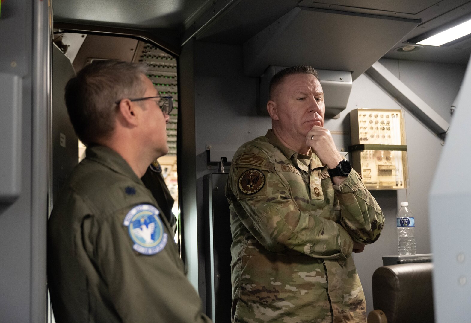 U.S. Air Force Chief Master Sgt. Chad Bickley, command chief of Air Education and Training Command (AETC), right, speaks with Lt. Col. John Cockburn, 56th Air Refueling Squadron commander, left, on a KC-46 Pegasus at Altus Air Force Base, Oklahoma, Feb. 18, 2026. The immersion demonstrated AETC leadership’s dedication to fully connecting to the wing's mission of developing the decisive mobility force of the future. (U.S. Air Force photo by Airman 1st Class Emma Wright)