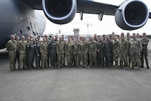 U.S. Airmen supporting Operation Deep Freeze take a group photo with Lt. Gen. Rebecca Sonkiss, Air Mobility Command interim commander, at Christchurch, New Zealand, Feb. 4, 2026. Active Duty and Reserve Airmen flew from McChord Field to New Zealand to support the National Science Foundation with cargo and personnel airlift. (U.S. Air Force photo by Staff Sgt. Ethan Sherwood)