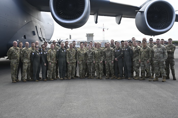 U.S. Airmen supporting Operation Deep Freeze take a group photo with Lt. Gen. Rebecca Sonkiss, Air Mobility Command interim commander, at Christchurch, New Zealand, Feb. 4, 2026. Active Duty and Reserve Airmen flew from McChord Field to New Zealand to support the National Science Foundation with cargo and personnel airlift. (U.S. Air Force photo by Staff Sgt. Ethan Sherwood)