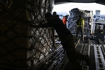 U.S. Airmen and Christchurch Airport personnel load supplies to bring to McMurdo Station in support of Operation Deep Freeze at Christchurch, New Zealand, Feb. 8, 2026. Christchurch has served as the primary logistics staging point for the United States Antarctic Program since 1955. (U.S. Air Force photo by Staff Sgt. Ethan Sherwood)
