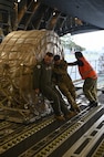 U.S. Airmen and Christchurch Airport personnel load a C-17 Globemaster III in preparation for a flight to McMurdo Station at Christchurch, New Zealand, Feb 8, 2026. Due to seasonal ice conditions in Antarctica, Operation Deep Freeze’s aircraft operations require months of precise planning to ensure the runway and safely support a C-17. (U.S. Air Force photo by Staff Sgt. Ethan Sherwood)