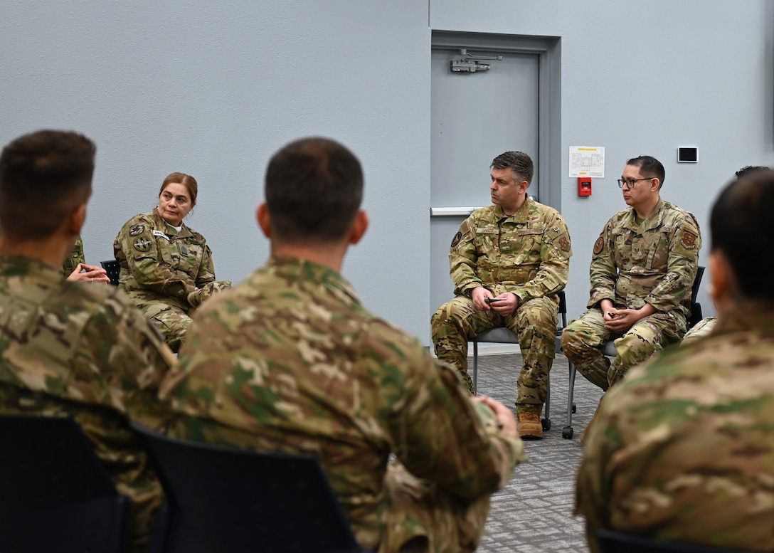 U.S. Air Force Col. Brian Gavitt, Air Forces Southern command surgeon, center, engages with Argentine air force personnel, at Morris Air National Guard Base, Arizona, Jan. 9, 2026. As a career trauma surgeon, Gavitt discussed topics on physical therapy, medical standards and in-flight emergencies. (U.S. Air Force photo by Staff Sgt. Abbey Rieves)