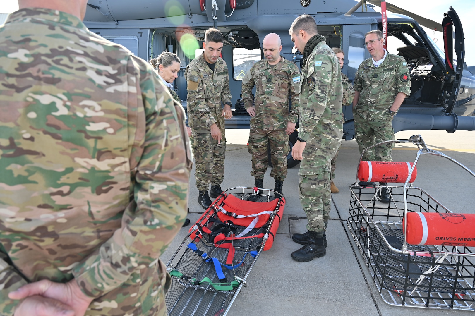 Fuerza Aérea Argentina (FAA) members visit the 305th Rescue Squadron, to discuss combat search and rescue capabilities at Davis-Monthan Air Force Base, Arizona, Jan. 6, 2026. The 305th RQS showcased its CSAR capabilities, which play a vital role to an F-16 program by supporting pilot survivability, mission effectiveness and strategic decision-making. (U.S. Air Force photo by Staff Sgt. Abbey Rieves)