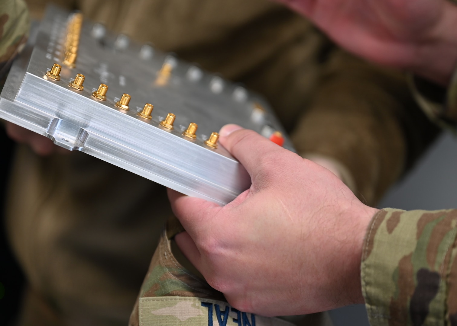 U.S. Space Force Master Sgt. Justin Neal, Space Forces Southern planner, inspects radar technology during a commercial radar site visit in Pearce, Arizona, Feb. 17, 2026. Guardians learned how the technology supports broader space domain awareness efforts. (U.S. Air Force photo by Staff Sgt. Abbey Rieves)