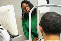 Tamara Kilifred, an optometry technician with the Bolling Medical Squadron, operates an ultra-wide camera during eye exam training at Joint Base Anacostia-Bolling, Washington, D.C., Feb. 20, 2026. The camera was used to detect and monitor eye disease and captured high-resolution images of the retina. (U.S. Air Force photo by Airman 1st Class Shanel Toussaint)