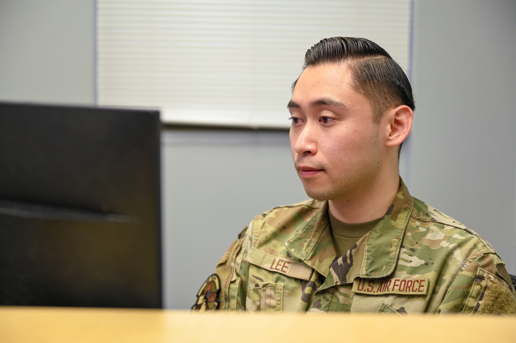 U.S. Air Force Senior Airman Toby Lee, health services management technician with the Bolling Medical Squadron, files health information for patients at Joint Base Anacostia-Bolling, Washington, D.C., Feb. 20, 2026. Comprised of Air Force medical professionals from several specialties, the Bolling Medical Squadron provides world-class medical care for service members and military families. (U.S. Air Force photo by Airman 1st Class Shanel Toussaint)