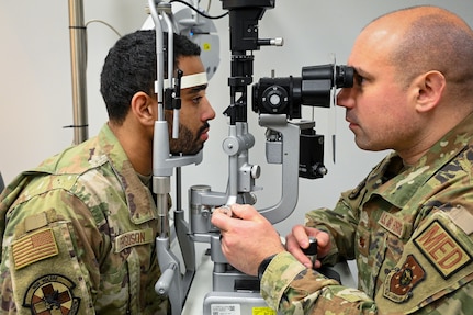 U.S. Air Force Maj. Matthew Tholl, optometrist with the Bolling Medical Squadron, demonstrates an eye exam at Joint Base Anacostia-Bolling, Washington, D.C., Feb. 20, 2026.