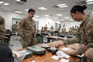 Airmen look over equipment