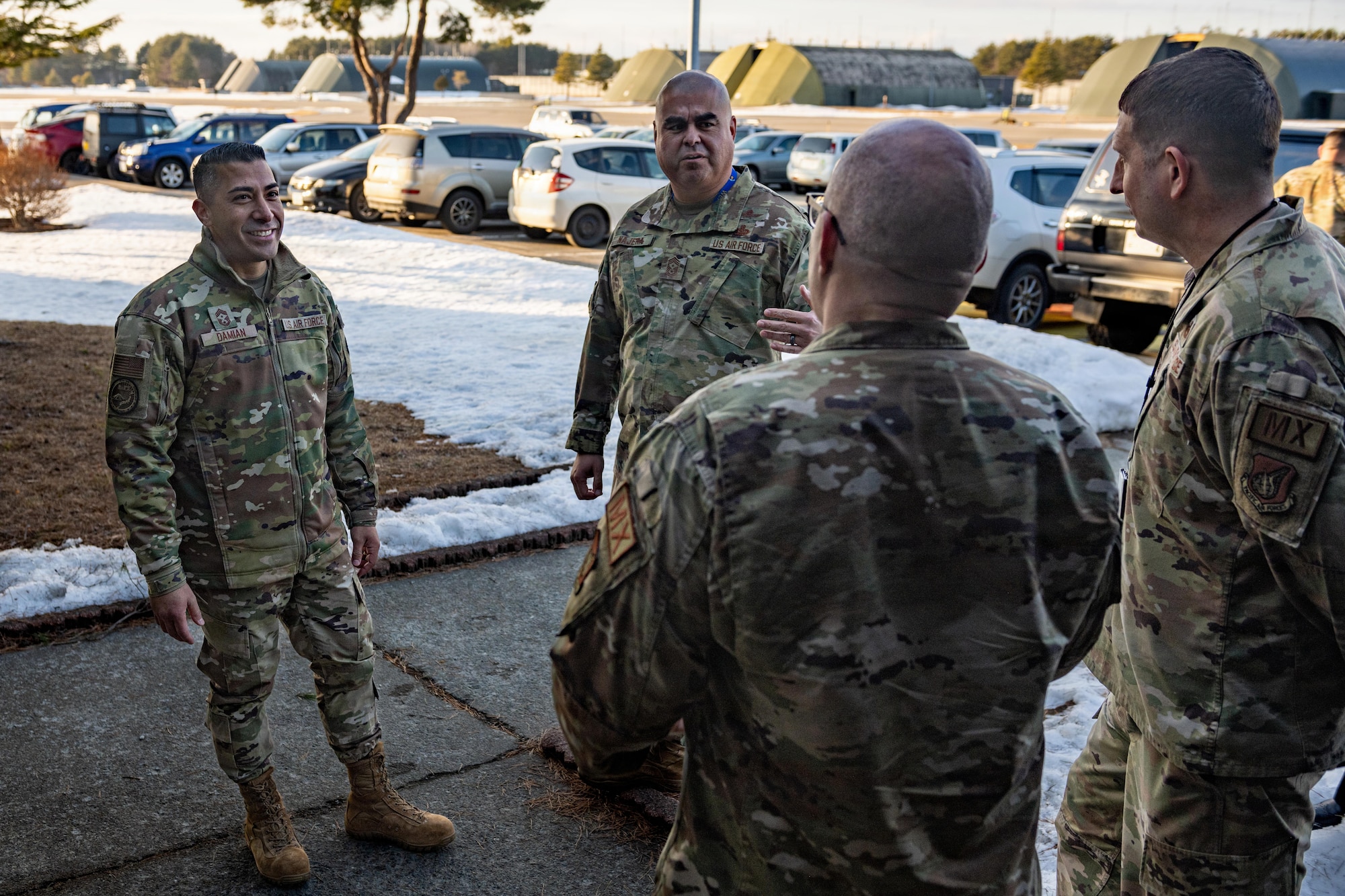 U.S. Air Force Chief Master Sgt. Carlos Damian, U.S. Forces Japan (USFJ) command senior enlisted leader, left, and Chief Master Sgt. David Najera, 35th Fighter Wing (FW) command chief, listens to a brief from leaders assigned to the 14th Fighter Generation Squadron.
