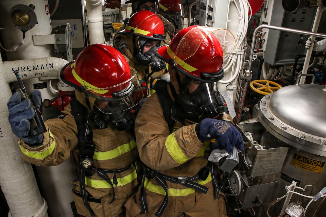 U.S. Sailors combat a simulated fire during a general quarters drill aboard Arleigh Burke-class guided-missile destroyer USS Frank E. Petersen Jr. (DDG 121), in the Arabian Sea, Feb. 11, 2026. Frank E. Peterson Jr. is deployed to the U.S. 5th Fleet area of operations to support maritime security and stability in the Middle East. (U.S. Navy photo by Mass Communication Specialist 2nd Class Christian Kibler)