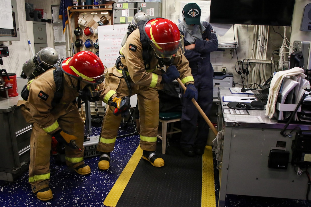 U.S. Sailors investigate a space during a general quarters drill aboard Arleigh Burke-class guided-missile destroyer USS Frank E. Petersen Jr. (DDG 121), in the Arabian Sea, Feb. 11, 2026. Frank E. Peterson Jr. is deployed to the U.S. 5th Fleet area of operations to support maritime security and stability in the Middle East. (U.S. Navy photo by Mass Communication Specialist 2nd Class Christian Kibler)